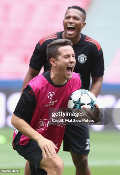 Antonio Valencia and Ander Herrera of Manchester United in action during a training session ahead of their UEFA Champions League match against...