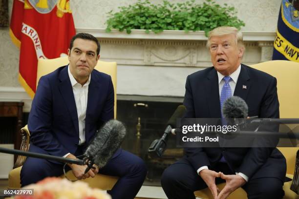 President Donald Trump welcomes Greek Prime Minister Alexis Tsipras in the Oval Office on October 17, 2017 at the White House in Washington, DC. A...