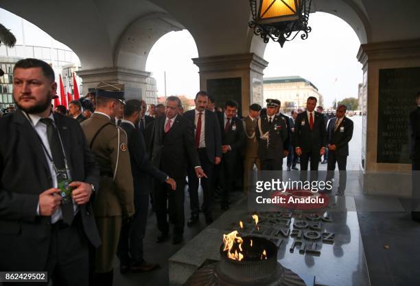 President of Turkey, Recep Tayyip Erdogan receives information about the tomb after laying a Turkish flag wreath during his visit to the Tomb of the...