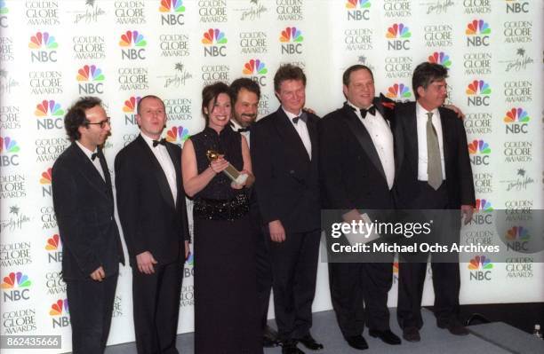 The production team for Shakespeare in Love pose backstage after receiving the award for Best Film - Musical or Comedy on January 24, 1999 at the...