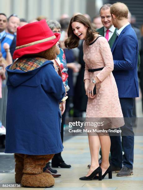 Paddington Bear greets Catherine, Duchess of Cambridge as she attends the Charities Forum Event at Paddington Station on October 16, 2017 in London,...
