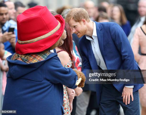 Paddington Bear greets Prince Harry as he attends the Charities Forum Event at Paddington Station on October 16, 2017 in London, England.