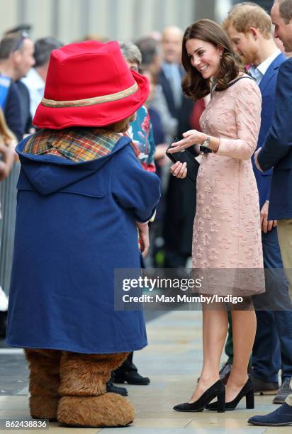 Paddington Bear greets Catherine, Duchess of Cambridge as she attends the Charities Forum Event at Paddington Station on October 16, 2017 in London,...