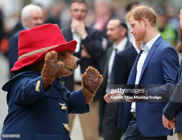 Paddington Bear talks with Prince Harry as he attends the Charities Forum Event at Paddington Station on October 16, 2017 in London, England.