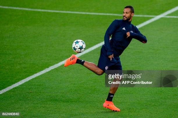 Olympiacos' French-Togolese midfielder Alaixys Romao controls the ball during a training session at the Camp Nou stadium in Barcelona on October 17,...
