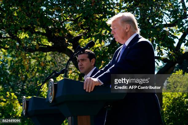 President Donald Trump and Greece's Prime Minister Alexis Tsipras hold a joint press conference in the Rose Garden of the White House in Washington,...