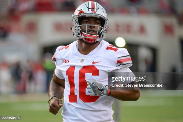 Quarterback J.T. Barrett of the Ohio State Buckeyes warms up before the game against the Nebraska Cornhuskers at Memorial Stadium on October 14, 2017...