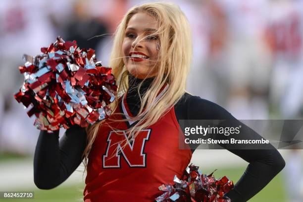 Cheer leader for the Nebraska Cornhuskers performs before the start of the game against the Ohio State Buckeyes at Memorial Stadium on October 14,...