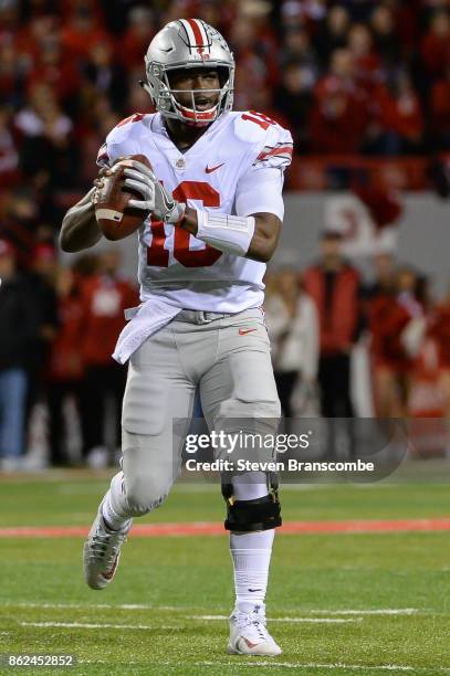 Quarterback J.T. Barrett of the Ohio State Buckeyes looks to pass against the Nebraska Cornhuskers at Memorial Stadium on October 14, 2017 in...