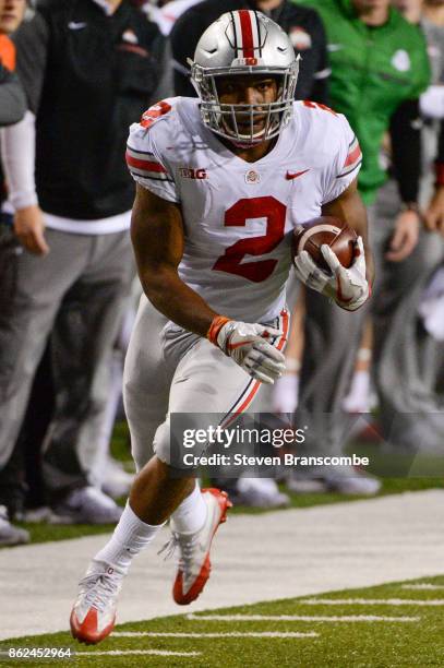 Running back J.K. Dobbins of the Ohio State Buckeyes runs against the Nebraska Cornhuskers at Memorial Stadium on October 14, 2017 in Lincoln,...