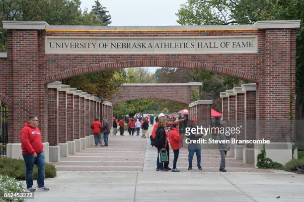 Fans of the Nebraska Cornhuskers walk through the Athletics Hall of Fame display before the game against the Ohio State Buckeyes at Memorial Stadium...