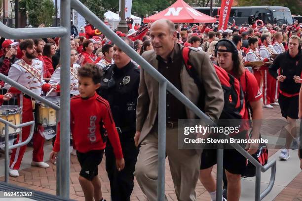 Head coach Mike Riley of the Nebraska Cornhuskers arrives at the stadium with the team before the game against the Ohio State Buckeyes at Memorial...