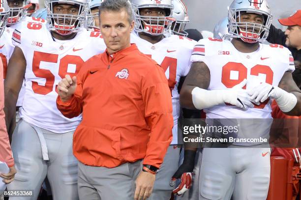 Head coach Urban Meyer of the Ohio State Buckeyes waits to lead the team on the field against the Nebraska Cornhuskers at Memorial Stadium on October...