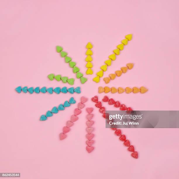 candy heart starburst - starburst galaxy stock pictures, royalty-free photos & images