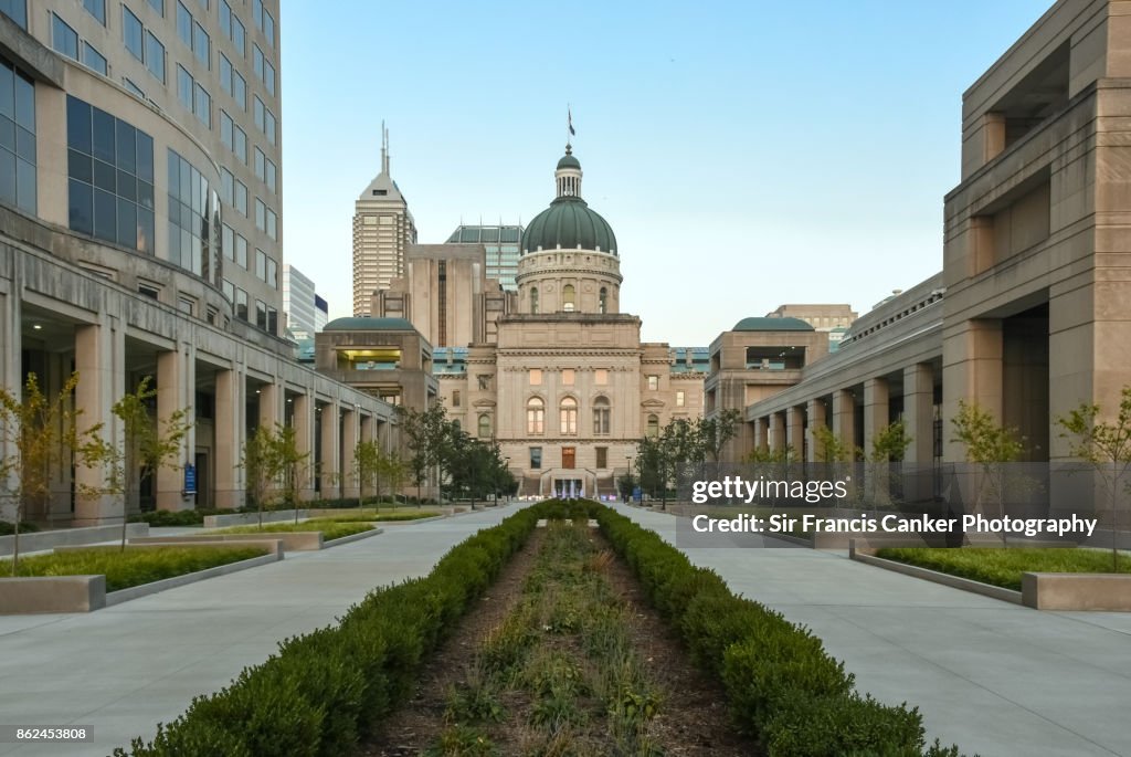 Majestic Indiana State Capitol facade at dusk with skyscrapers on background in Indianapolis, Indiana, USA