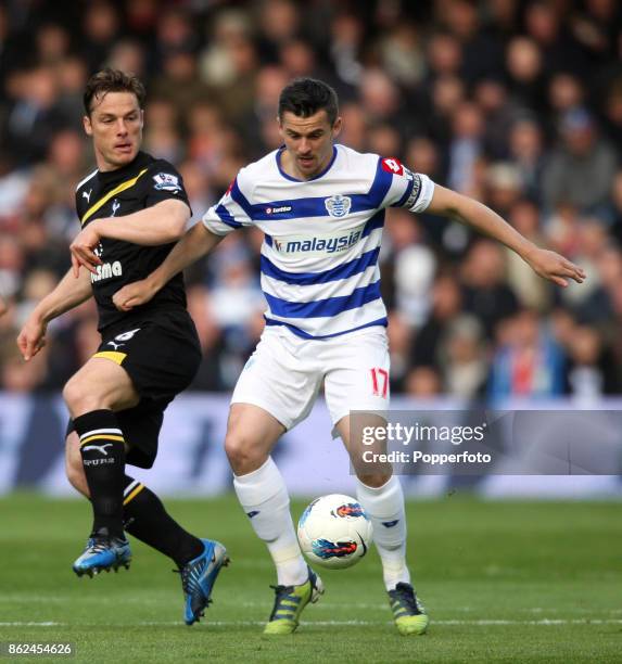 Scott Parker of Tottenham and Joey Barton of Queens Park Rangers in action during the Barclays Premier League match at Loftus Road on April 21, 2012...