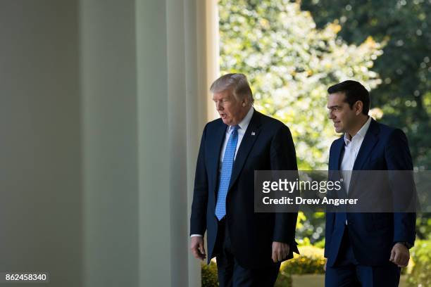 President Donald Trump and Greek Prime Minister Alexis Tsipras arrive for a joint press conference in the Rose Garden at the White House October 17,...