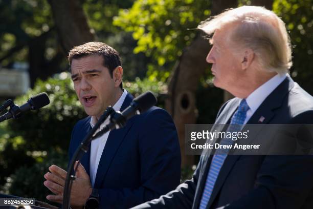 Greek Prime Minister Alexis Tsipras speaks as U.S. President Donald Trump looks on during a joint press conference in the Rose Garden at the White...