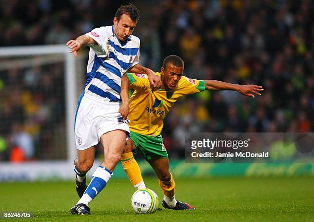 Ryan Bertrand of Norwich battles with Glen Little of Reading during the Coca-Cola Championship match between Norwich City and Reading at Carrow Road...