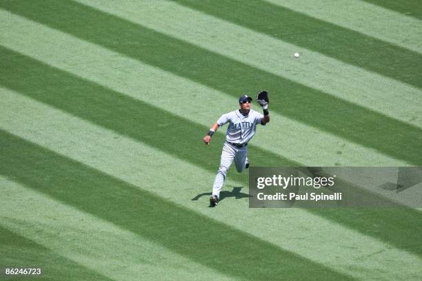 Centerfielder Franklin Gutierrez of the Seattle Mariners catches a fly ball hit by Robb Quinlan of the Los Angeles Angels of Anaheim for the third...