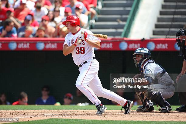Robb Quinlan of the Los Angeles Angels of Anaheim hits an infield single with two outs in the bottom of the seventh inning during the game against...