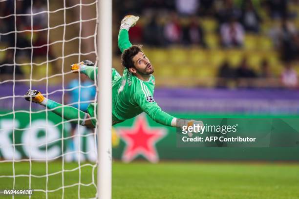 Besiktas' Spanish goalkeeper Fabricio Agosto Ramirez eyes the ball after making a save during the UEFA Champions League group stage football match...