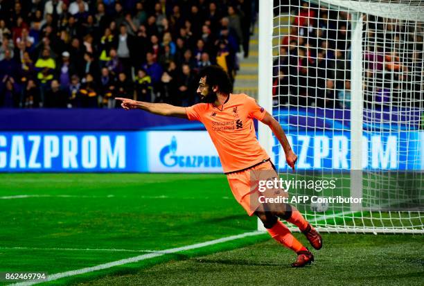 Liverpool's Egyptian forward Mohamed Salah celebrates after scoring a goal during the UEFA Champions League group E football match between NK Maribor...