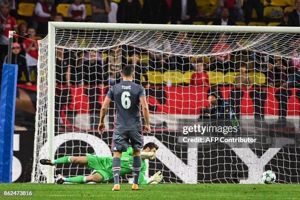 Besiktas' Spanish goalkeeper Fabricio Agosto Ramirez fails to stop the opening goal during the UEFA Champions League group stage football match...