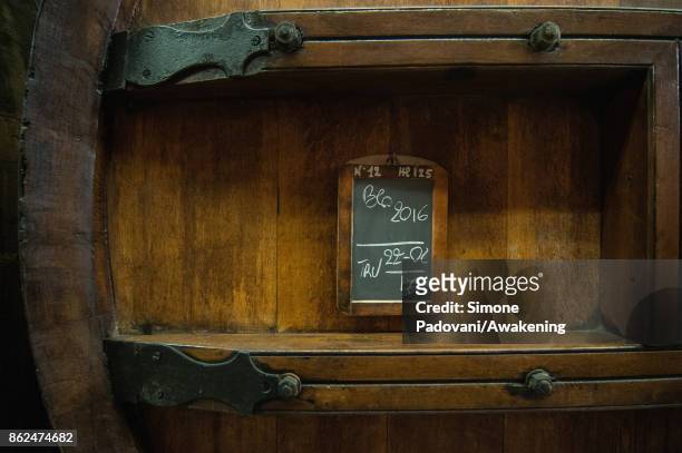 Detail of a barrel of a winery of Barolo on October 17, 2017 in the Barolo region , Italy. Because of the high summer temperatures, Barolo's harvest...