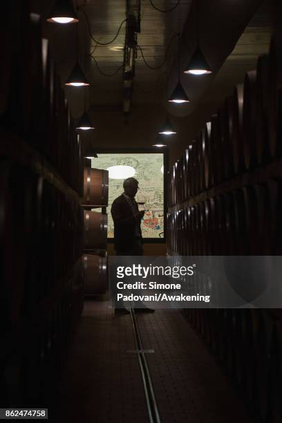 Ernesto Abbona the owner of Marchesi di Barolo winery, taste a glass of Barolo on October 17, 2017 in the Barolo region , Italy. Because of the high...