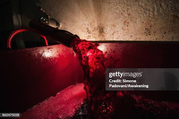 Wine is seen during a decants on October 17, 2017 in the Barolo region , Italy. Because of the high summer temperatures, Barolo's harvest has been...