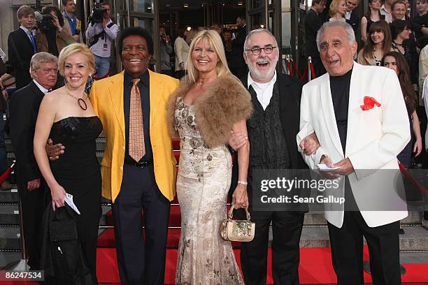 Singer Roberto Blanco and his girlfriend Luzandra Strassburg, singer and dancer Marlene Charell, styilst Udo Walz and Charell's husband Roger Pappini...