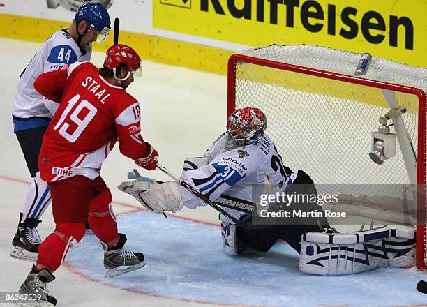 Karri Ramo , goalkeeper of Finland saves the shoot of Kim Staal of Denmark during the IIHF World Ice Hockey Championship preliminary round, group D...