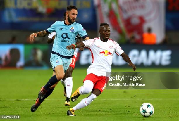 Naby Keita of RB Leipzig and Miguel Layún of FC Porto battle for posession during the UEFA Champions League group G match between RB Leipzig and FC...