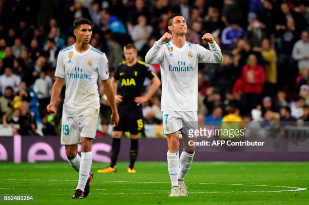 Real Madrid's Portuguese forward Cristiano Ronaldo celebartes after scoring during the UEFA Champions League group H football match Real Madrid CF vs...