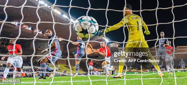 Monaco's Croatian goalkeeper Danijel Subasic fails to stop an equalizing goal by Besiktas' forward Cenk Tosun during the UEFA Champions League group...