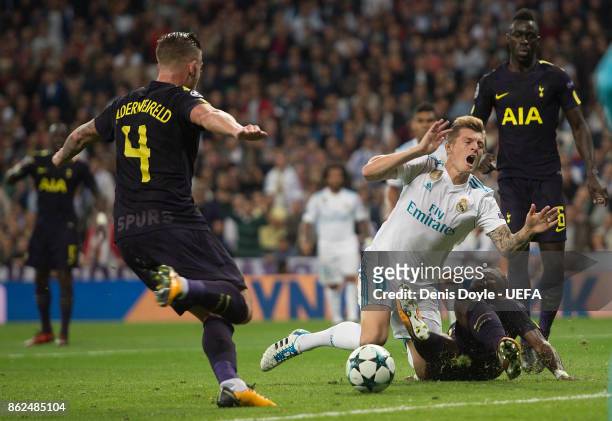 Toni Kroos of Real Madrid CF is brought down by Serge Aurier of Tottenham for a penalty kick during the UEFA Champions League group H match between...