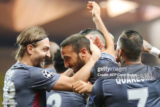 Besiktas' forward Cenk Tosun celebrates with Besiktas' defender Caner Erkin and Besiktas' Portuguese midfielder Ricardo Quaresma after scoring his...