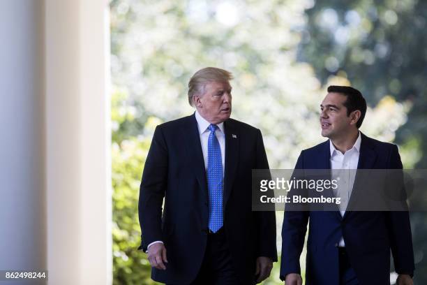 President Donald Trump and Alexis Tsipras, Greece's prime minister, right, exit the Oval Office before a joint press conference in the Rose Garden of...