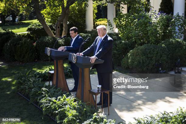 Alexis Tsipras, Greece's prime minister, speaks as U.S. President Donald Trump. Right, listens during a joint press conference in the Rose Garden of...