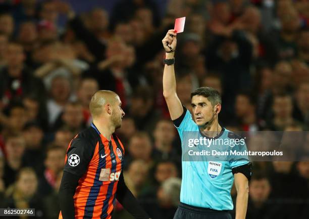 Yaroslav Rakitskiy of Shakhtar Donetsk is shown a red card by referee Alberto Undiano Mallenco during the UEFA Champions League group F match between...