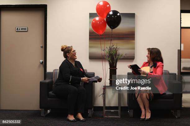 Sophia Wesley , a J.C. Penny supervisor for appliances, speaks with Janice Montalvo as she prepares to be interviewed for a seasonal job during a job...