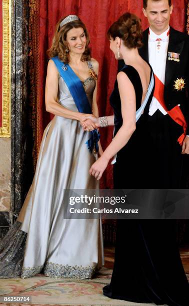 Princess Letizia of Spain and Carla Bruni attend a Gala Dinner honouring French President Nicolas Sarkozy at the Royal Palace on April 27, 2009 in...