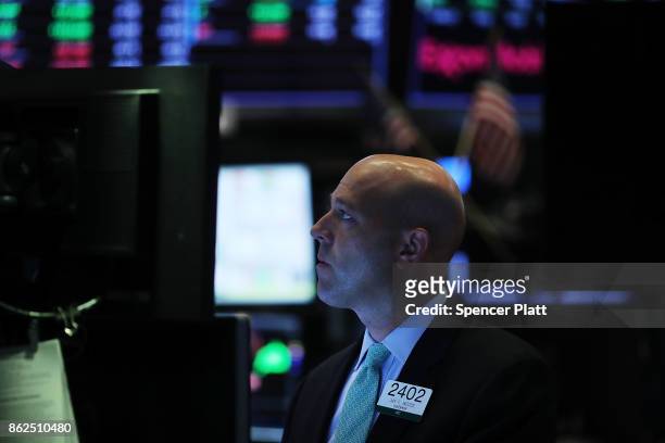 Trader works on the floor of the New York Stock Exchange on October 17, 2017 in New York City. The Dow Jones Industrial average briefly rose to...