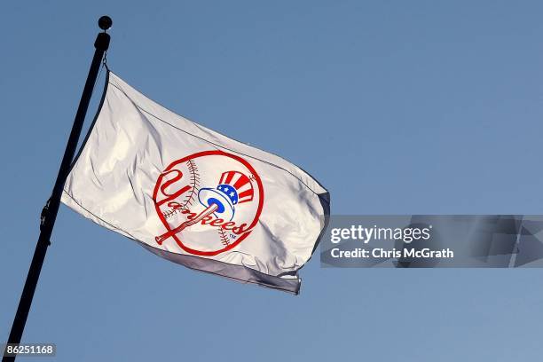 Yankee flag waves over the new stadium during opening day between the New York Yankees and the Cleveland Indians at the new Yankee Stadium on April...