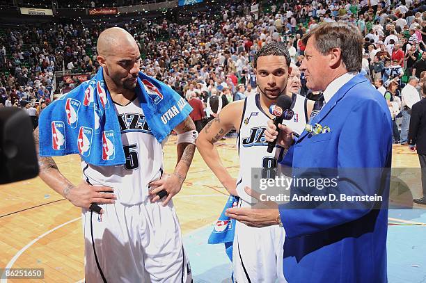 Craig Sager of TNT interviews Deron Williams and Carlos Boozer of the Utah Jazz following their victory n Game Three of the Western Conference...