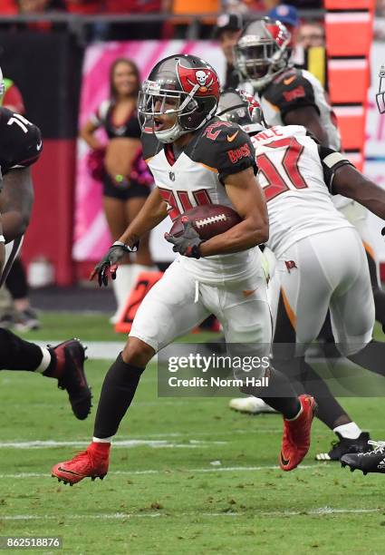 Brent Grimes of the Tampa Bay Buccaneers runs with the ball after intercepting a pass by Carson Palmer of the Arizona Cardinals at University of...