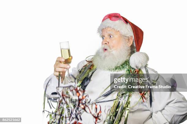 nice santa claus celebrating and dancing  with a glass of champagne and party favors - serpentin bildbanksfoton och bilder