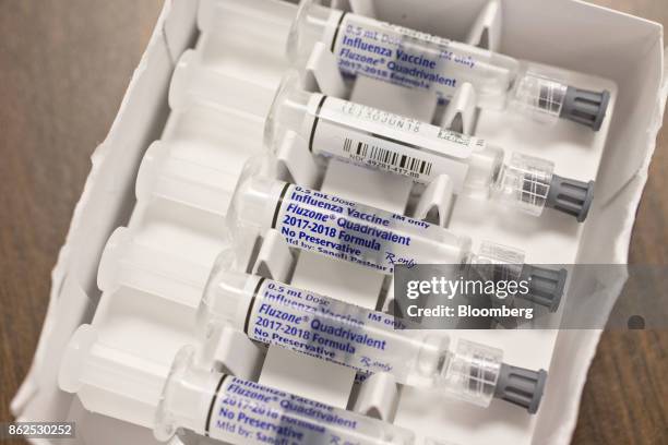 Viles of flu vaccine, manufactured by Sanofi Pasteur, are displayed for a photograph at Perry Memorial Hospital in Princeton, Illinois, U.S., on...