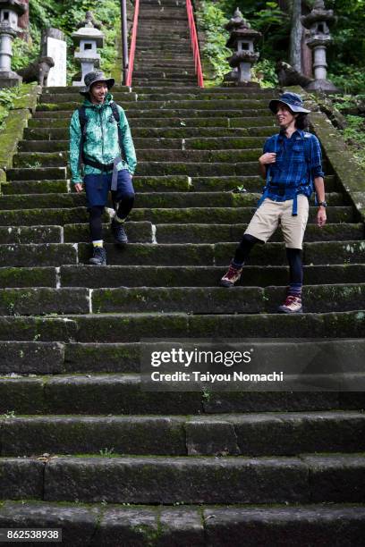 men who chat while getting off the stairs - préfecture de gunma photos et images de collection